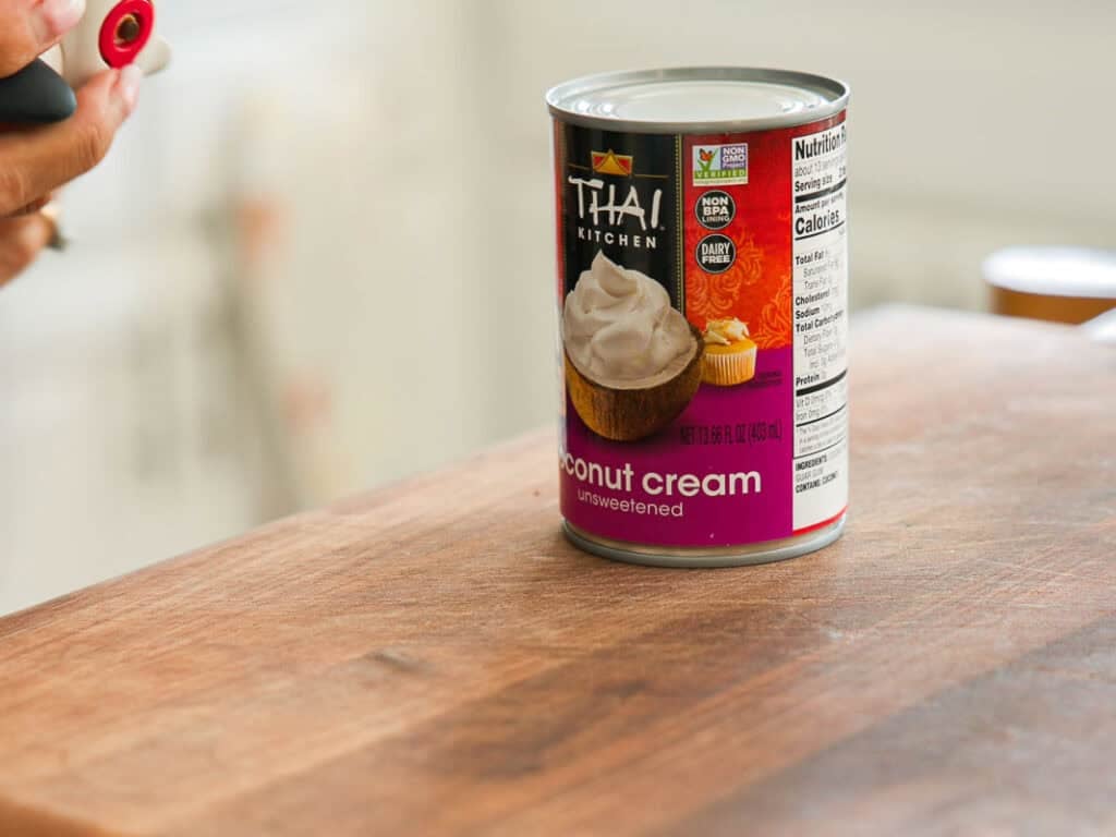 Easy & Delicious Vegan Chocolate Lava Cake Recipe. 21 A can of Thai Kitchen unsweetened coconut cream sits on a wooden countertop, with a person holding a can opener nearby. The label shows cupcakes topped with whipped cream.