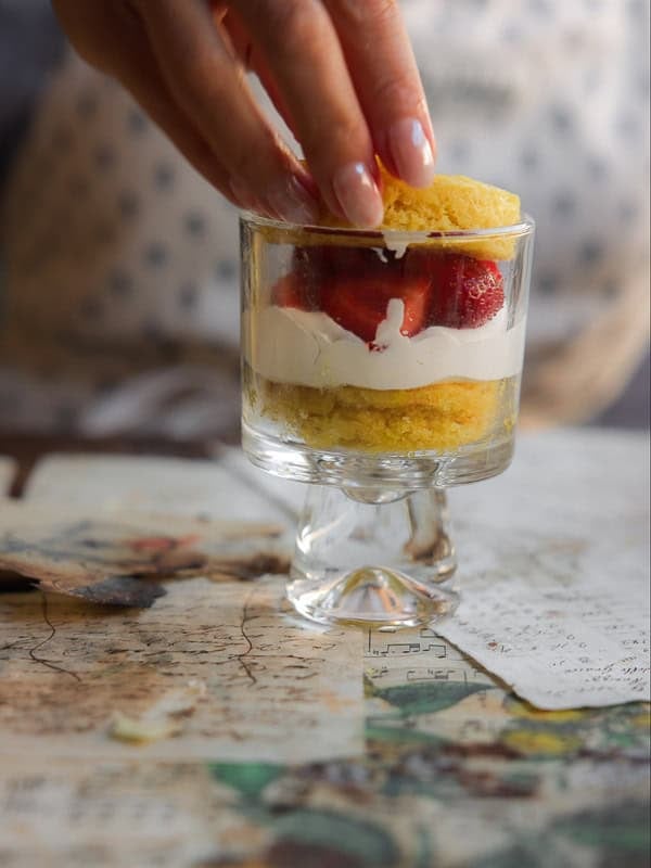 Delicious & Lemony Vegan Strawberry Shortcake Trifle. 46 Adding top layer to vegan strawberry shortcake trifle.