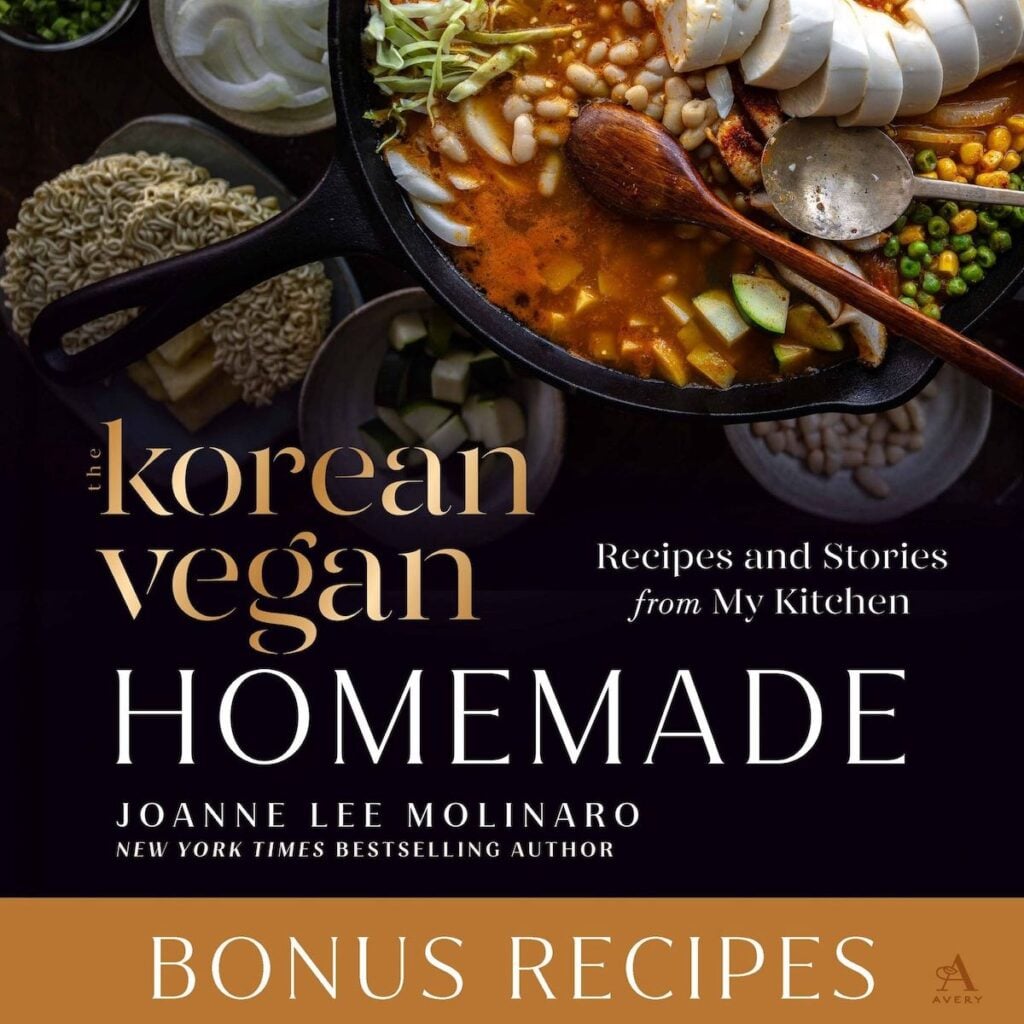 The Korean Vegan: HomeMade 42 Cover of The Korean Vegan: Homemade by Joanne Lee Molinaro, featuring a pot of soup with tofu, vegetables, and mushrooms, surrounded by raw noodles and spices—plus Bonus Recipes in gold at the bottom. Book PreOrder available now.