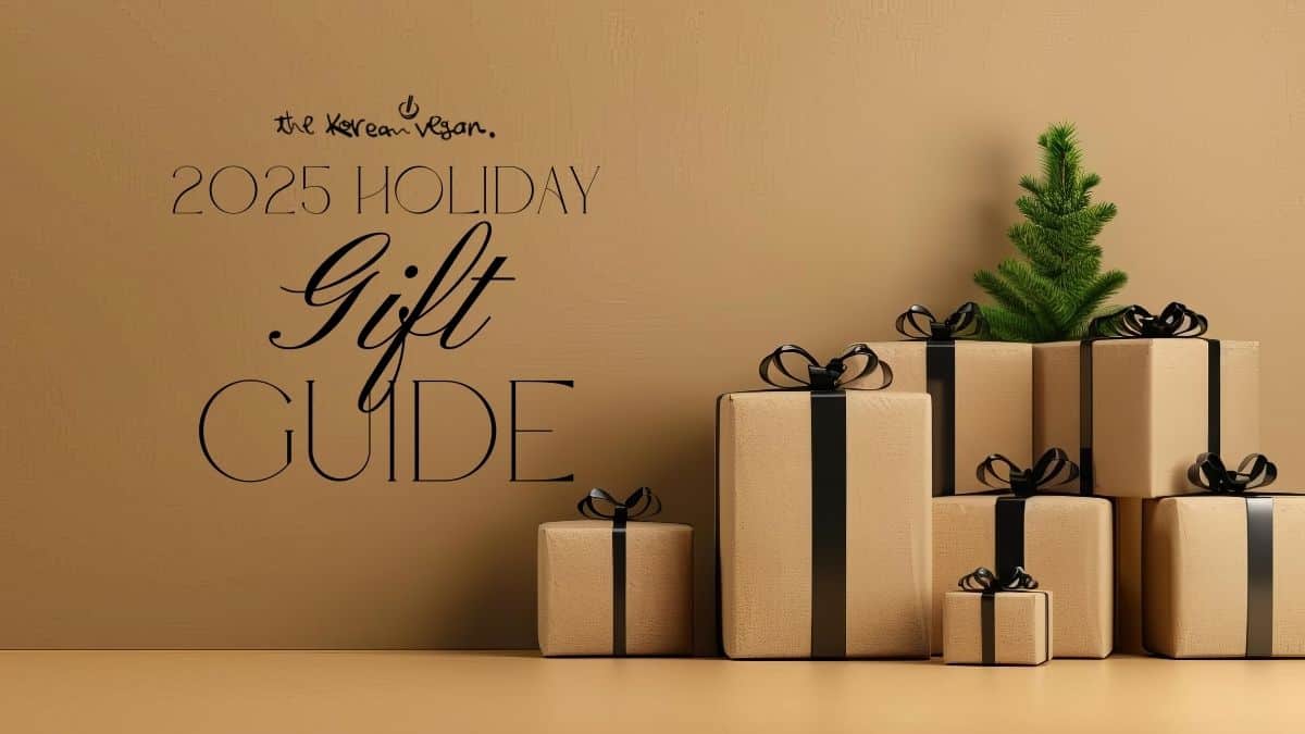 The Korean Vegan's 2025 VEGAN Holiday Gift GUIDE. 1 A minimalist holiday scene with beige gift boxes tied with black ribbons stacked beside a small green fir tree. Text reads “The Korean Vegan 2025 Holiday Gift Guide.”
