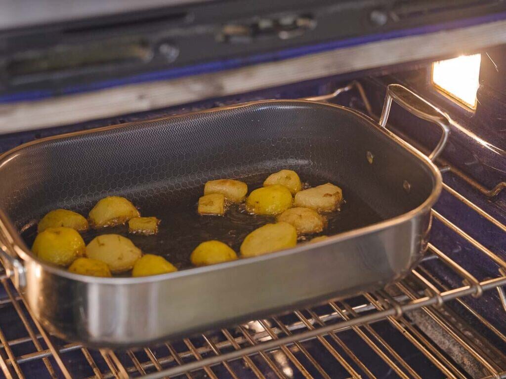 10 Tips for the Perfect Roasted Potatoes Recipe. 8 roasting pan filled with potatoes in oven