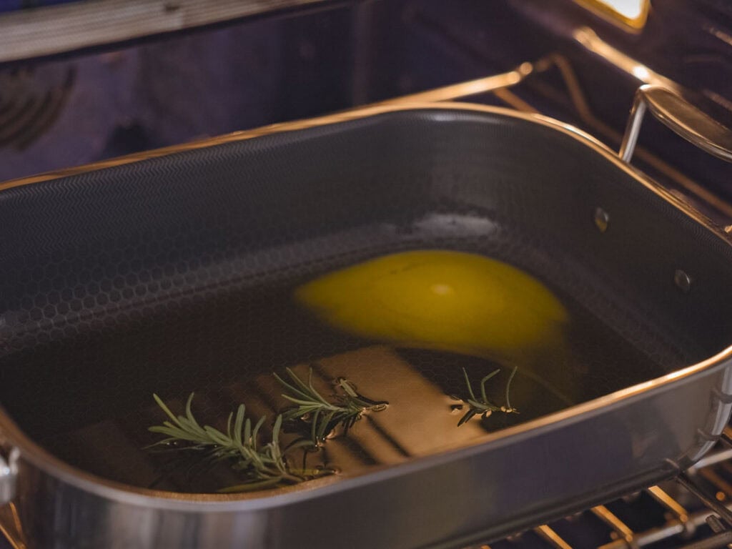 10 Tips for the Perfect Roasted Potatoes Recipe. 15 roasting pan with oil, melting butter, and sprigs of rosemary in oven