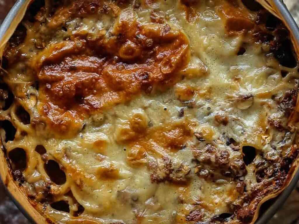 Cheesy Mushroom Rigatoni Pie - Easy Vegan Recipe. 51 close up top down view of mushroom rigatoni pie.