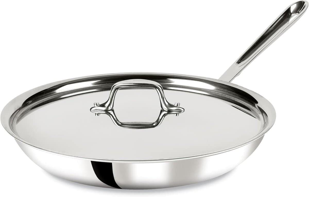 The Korean Vegan's 2025 VEGAN Holiday Gift GUIDE. 14 A shiny stainless steel frying pan with a lid and a long handle, perfect as a 2025 Vegan Holiday Gift or for any Korean Vegan kitchen, isolated on a white background.