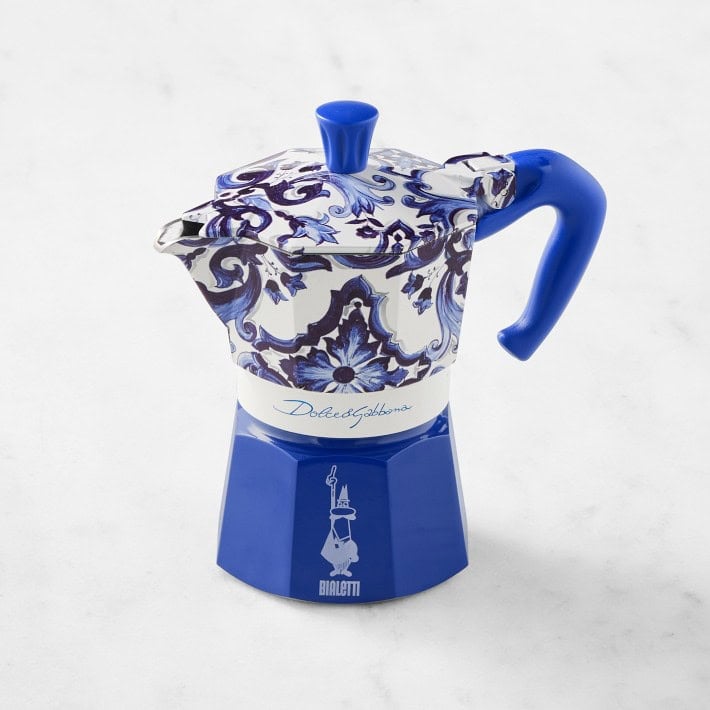 The Korean Vegan's 2025 VEGAN Holiday Gift GUIDE. 41 A blue and white stovetop espresso maker with ornate decorative patterns, featuring a curved blue handle and lid knob, branded with Bialetti and Dolce&Gabbana logos—an elegant pick for any Vegan Gift Guide or Holiday Gift Guide.