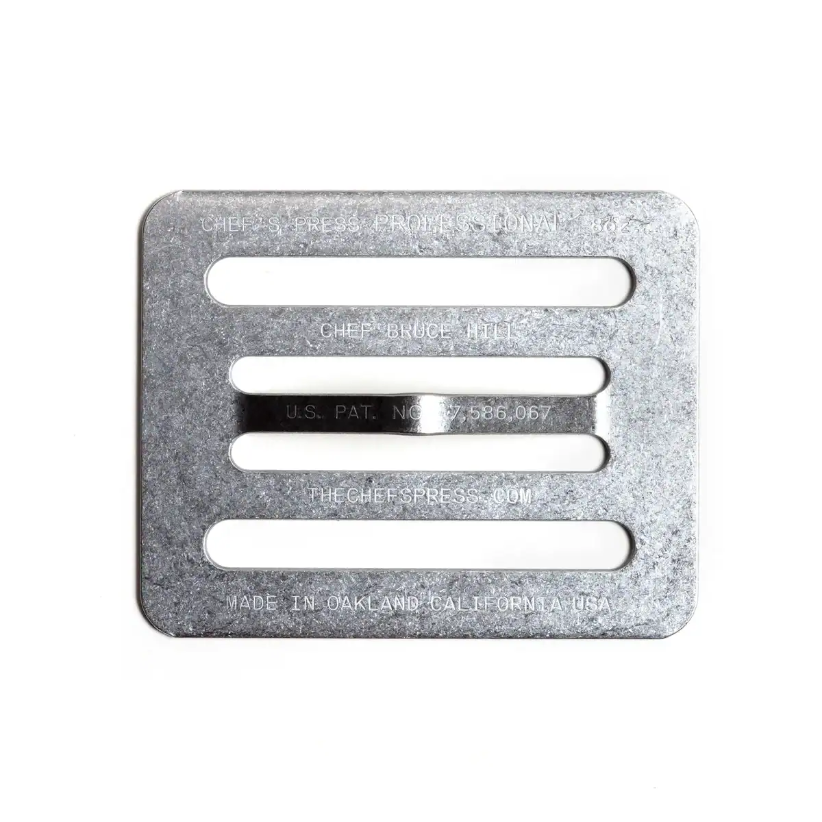 The Korean Vegan's 2025 VEGAN Holiday Gift GUIDE. 17 A rectangular, silver metal chef’s press with four horizontal slots and engraved text, photographed on a white background—a perfect 2025 Vegan Holiday Gift inspired by the Korean Vegan kitchen.