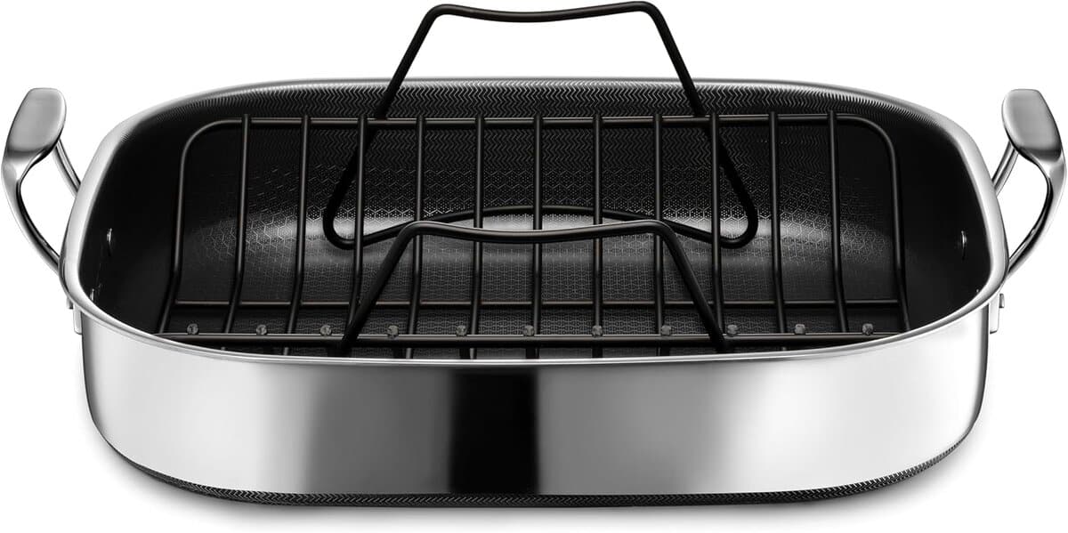 The Korean Vegan's 2025 VEGAN Holiday Gift GUIDE. 15 A large rectangular stainless steel roasting pan with two side handles and a removable black roasting rack, perfect as a 2025 Vegan Holiday Gift for the aspiring Korean Vegan, shown against a white background.